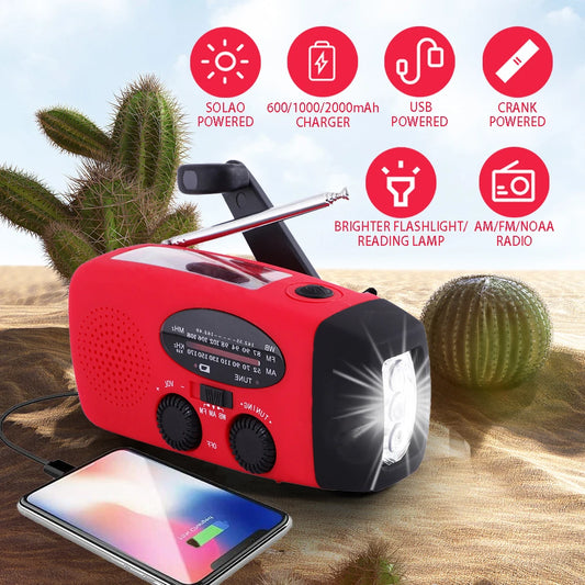 Red and black portable radio with flashlight and charging capabilities in a desert setting